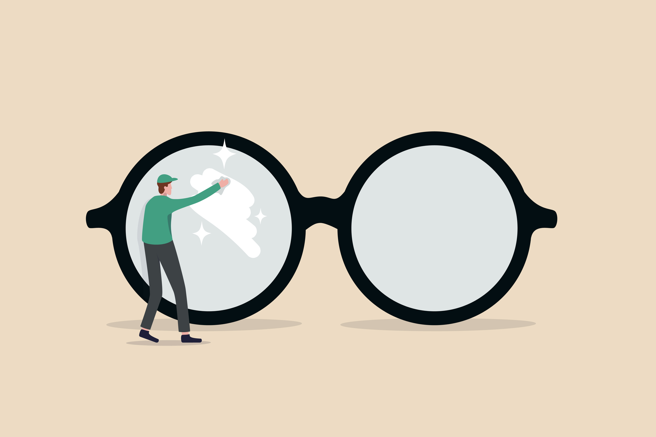 glasses with a person wiping one lens to clear it up