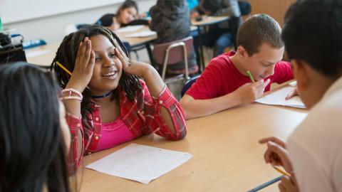Multicultural group of middle school students working on phonics and word study