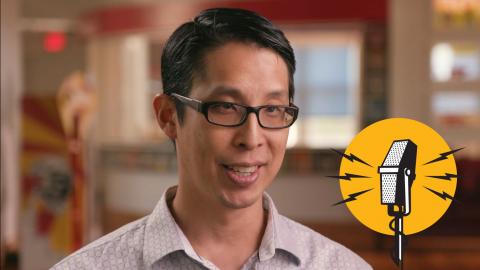 Author Gene Yang with retro graphic of microphone