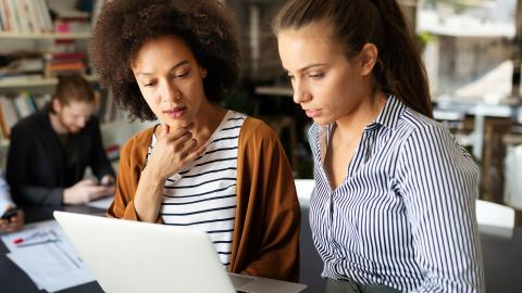 Two teachers talking about professional development course