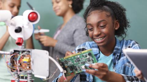 MG girl building a robot