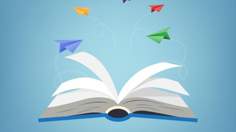 Paper airplanes flying out of an open book.