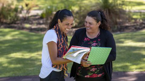 Two teachers conferencing outside