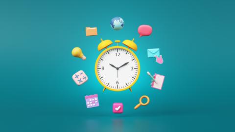 Alarm clock with school related symbols surrounded it
