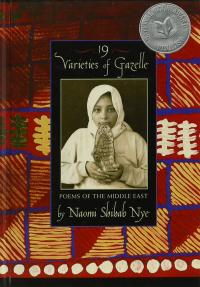 portrait of Middle Eastern girl in hijab holding a tablet with Arabic writing