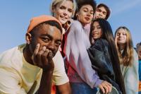 Diverse group of teenagers looking towards the camera as a group