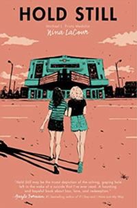 Two young women walking towards an abandoned movie theater.