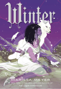 Young woman in a white dress sitting on the ground beside a white wolf