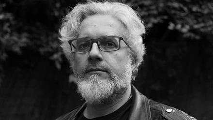 Headshot of Andrew Donkin in black and white