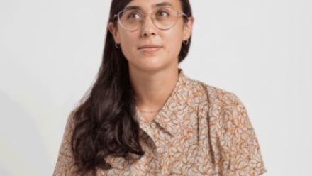Francesca Silva sitting cross legged on the floor