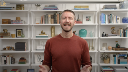 head shot of Ricky Robertson in front of a bookshelf
