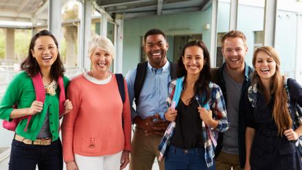 Group of teachers walking together and smiling