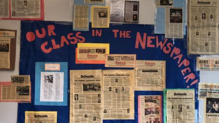 picture of op eds written by students posted on the classroom wall