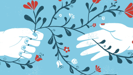 Two hands holding onto the same flowering vine.