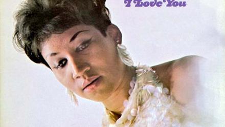 a young Aretha Franklin in a glittery dress and looking downward