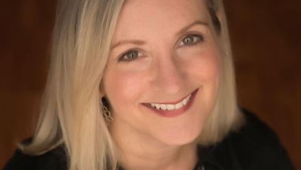 head sot of Sally J Pla; blond hair with black shirt