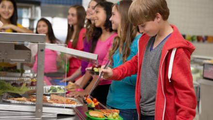 kids moving through the cafeteria line for lunch