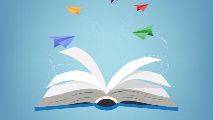 Paper airplanes flying out of an open book.