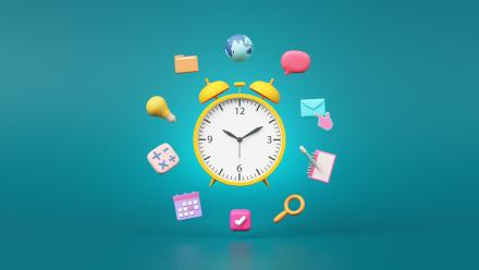 Alarm clock with school related symbols surrounded it