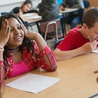 Multicultural group of middle school students working on phonics and word study