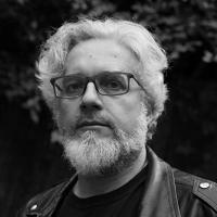 Headshot of Andrew Donkin in black and white