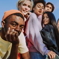 Diverse group of teenagers looking towards the camera as a group