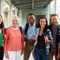 Group of teachers walking together and smiling