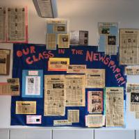 picture of op eds written by students posted on the classroom wall