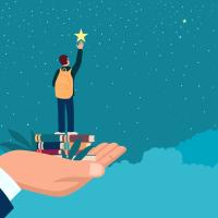 Man hand lifting up a school boy to reach for the star 